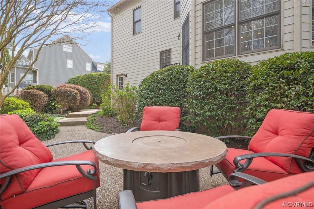 2713 Founders Bridge Road Midlothian, VA 23113 - Photo 43 of 49 a view of a patio with table and chairs potted plants