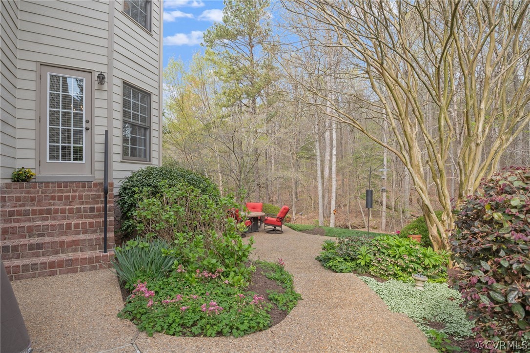 2713 Founders Bridge Road Midlothian, VA 23113 - Photo 44 of 49 a view of a backyard with flowers
