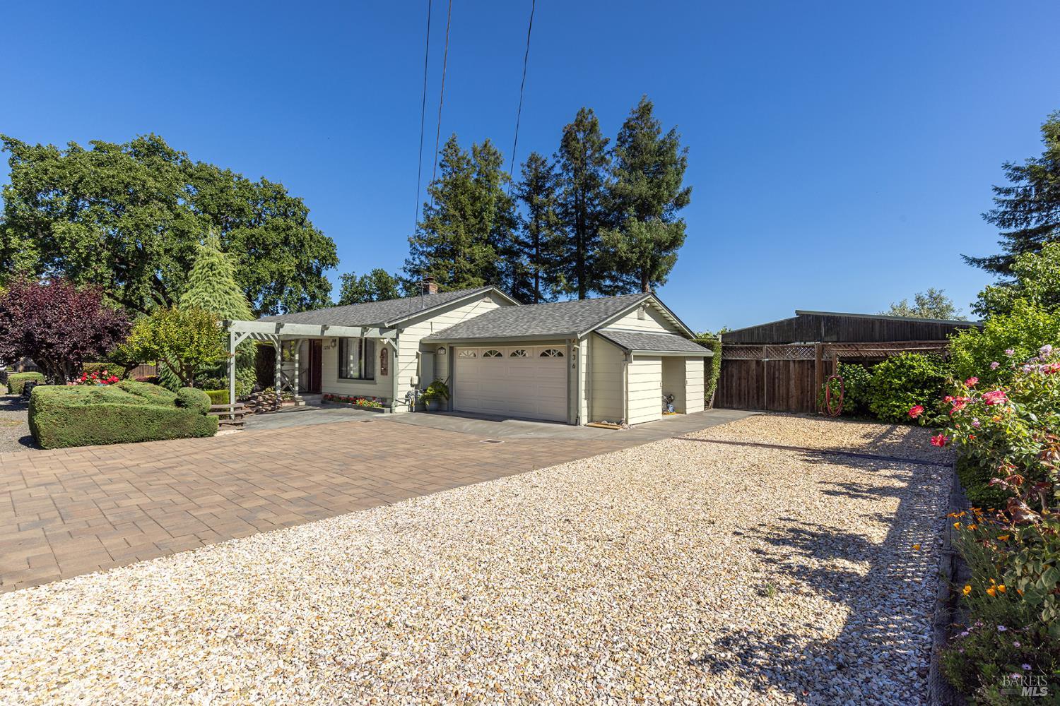2236 West Hearn Avenue Santa Rosa, CA 95407 - Photo 1 of 56 a front view of a house with a yard and garage
