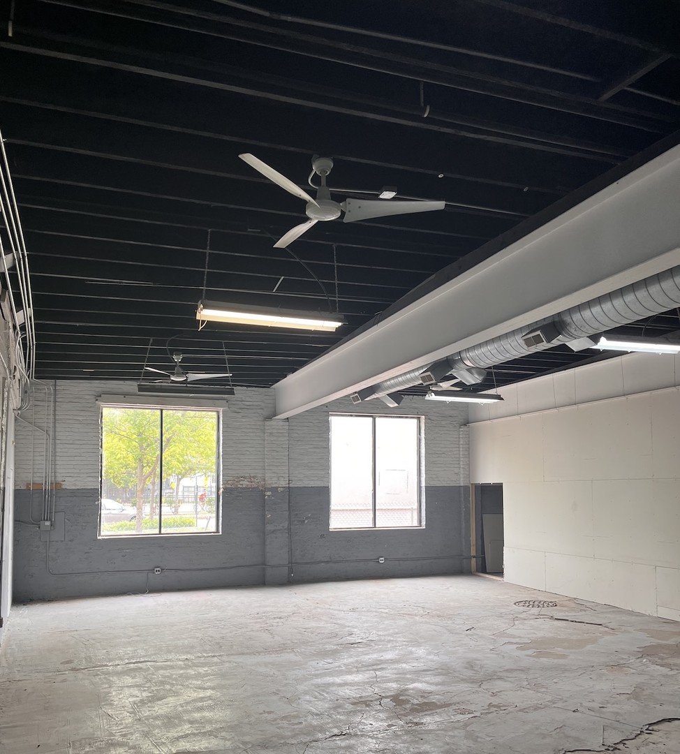 4138 South Archer Avenue, Unit R Chicago, IL 60632 - Photo 4 of 6 a view of an empty room with a window