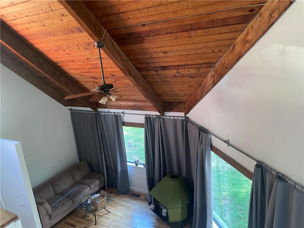 a view of a room with furniture and a window