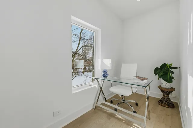 a bed room with a bed and a window