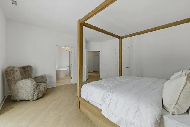 a bathroom with a granite countertop sink a toilet and a bathtub