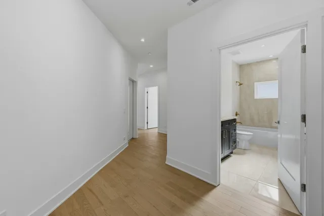 a bathroom with a sink toilet and mirror
