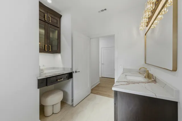 a bathroom with a shower sink and mirror