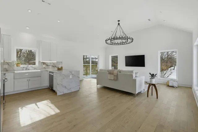 a living room with furniture and flat screen tv