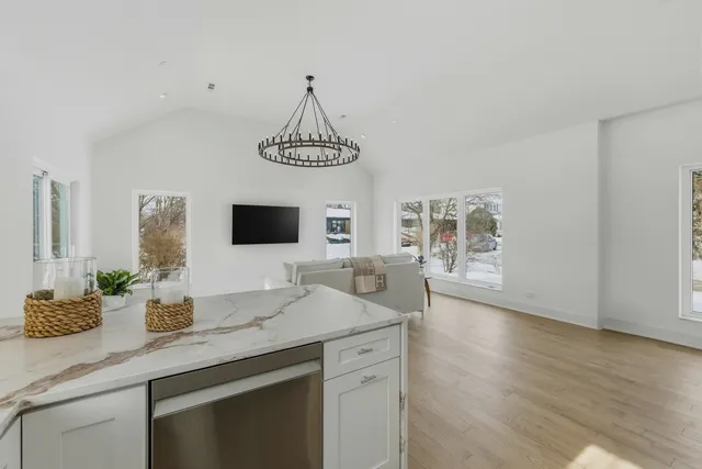 a kitchen with sink cabinets and microwave