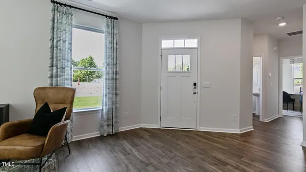 a view of room with furniture and wooden floor