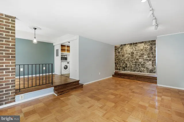 a view of an empty room with stairs