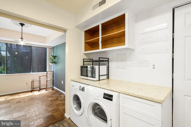a utility room with dryer and washer