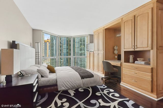 a bedroom with furniture and a window