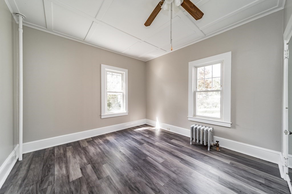 120 Winton Street Springfield, MA 01118 - Photo 13 of 25 a view of an empty room with wooden floor and a window