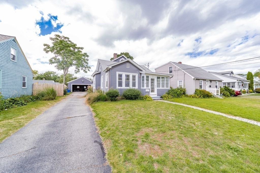 120 Winton Street Springfield, MA 01118 - Photo 2 of 25 a view of a house with a big yard and large trees