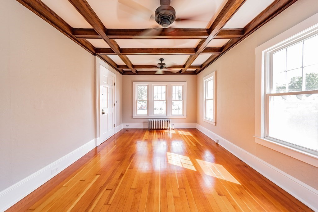 120 Winton Street Springfield, MA 01118 - Photo 3 of 25 a view of empty room with wooden floor and fan