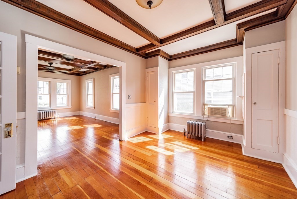 120 Winton Street Springfield, MA 01118 - Photo 5 of 25 a view of empty room with wooden floor and fan