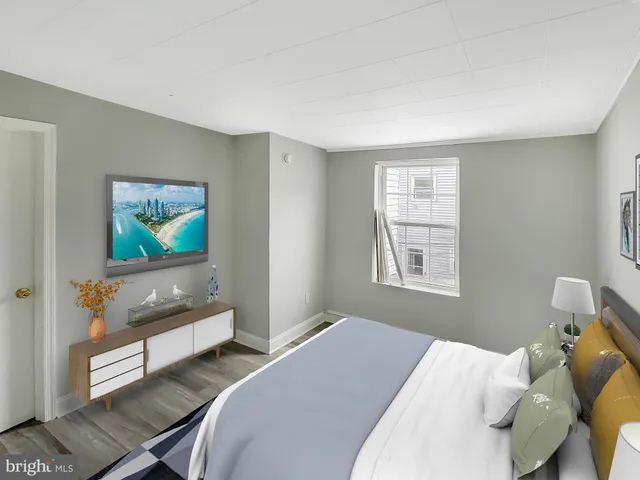 a bedroom with a bed and couch