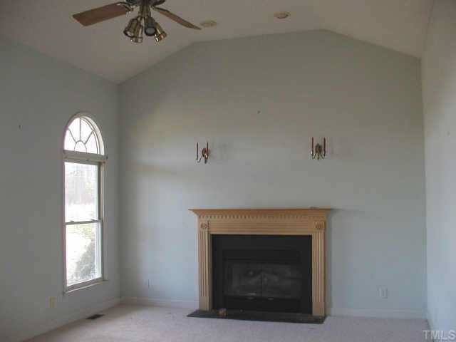 6516 Pentecost Road Cedar Grove, NC 27231 - Photo 2 of 11 Large great room features wood burning fireplace with gas logs, new carpet and built in entertainment center.