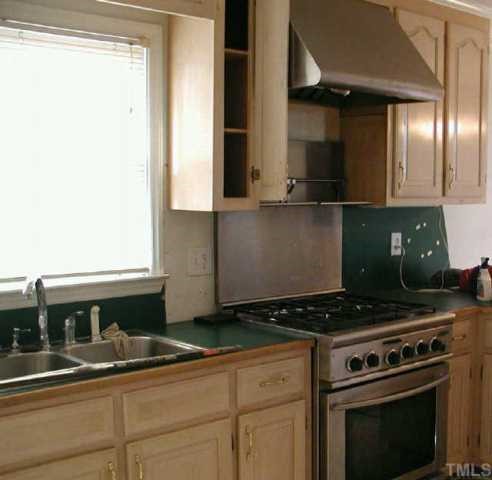 6516 Pentecost Road Cedar Grove, NC 27231 - Photo 4 of 11 Professional gas range and exhaust fan (features warming shelf!) only 2 years old.