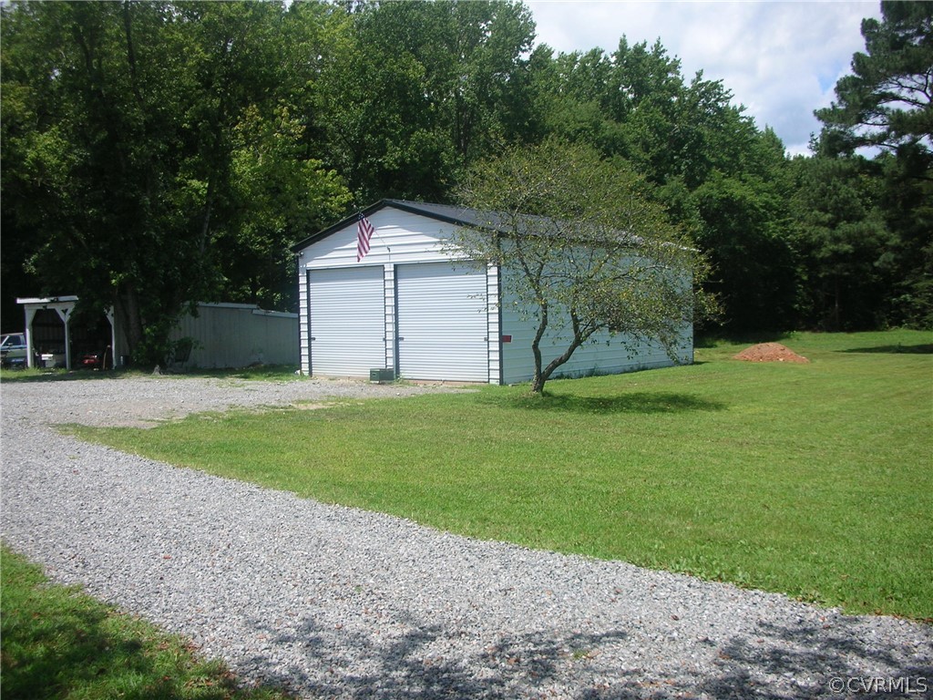 4795 Three Chopt Road Louisa, VA 23093 - Photo 2 of 4 a view of a house with a yard and large trees