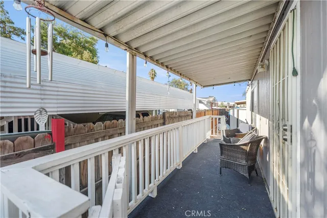 a view of a balcony with furniture