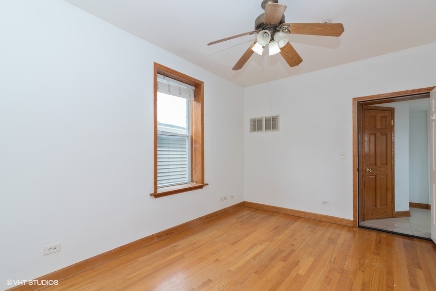 819 South Carpenter Street, Unit 3R Chicago, IL 60607 - Photo 2 of 10 a view of empty room with wooden floor
