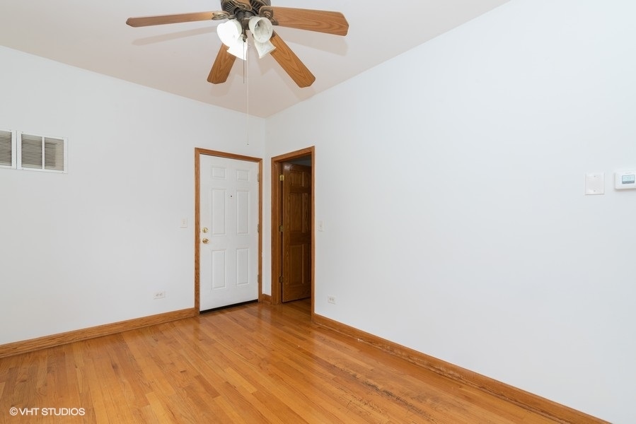 819 South Carpenter Street, Unit 3R Chicago, IL 60607 - Photo 3 of 10 a view of empty room with wooden floor