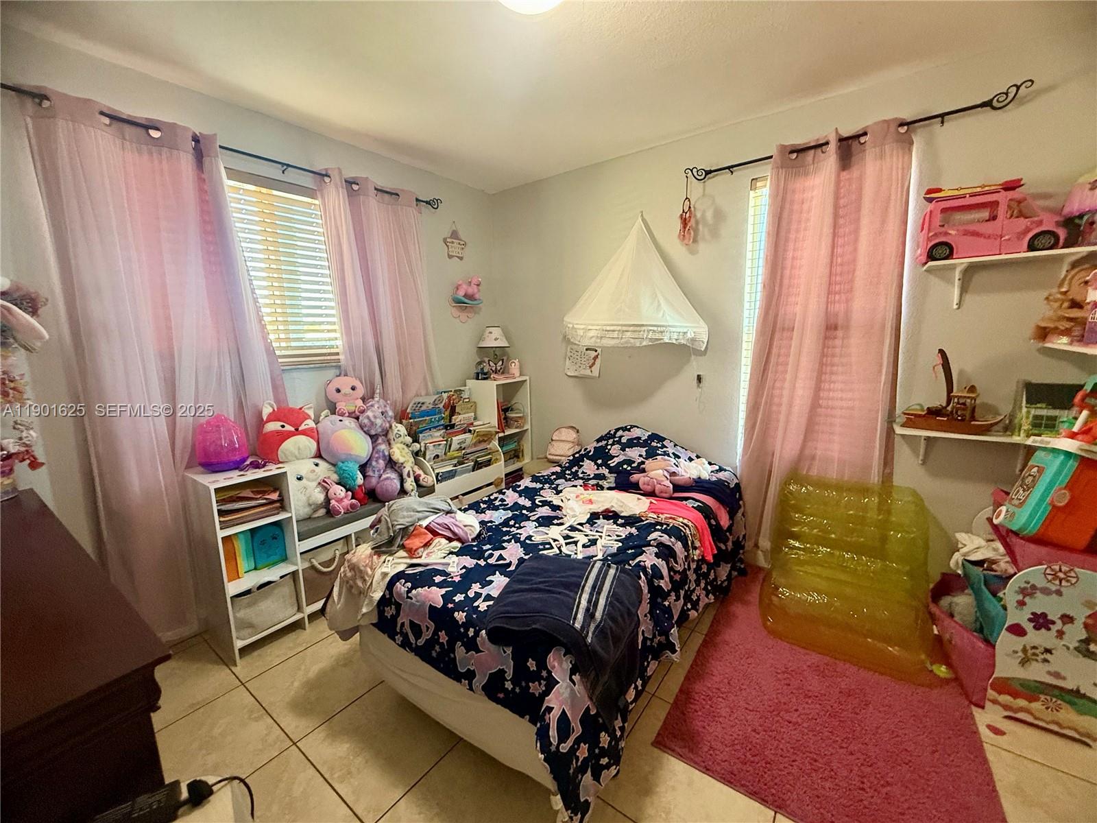 4201 Southwest 7th Street Miami, FL 33134 - Photo 4 of 23 a bed room with a bed and a window