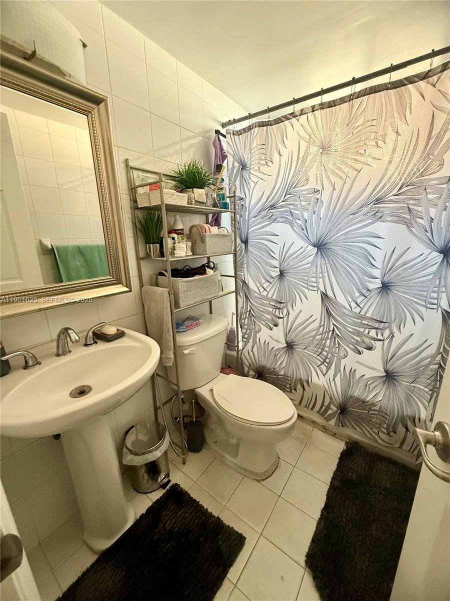 4201 Southwest 7th Street Miami, FL 33134 - Photo 5 of 23 a bathroom with a sink a toilet and shower