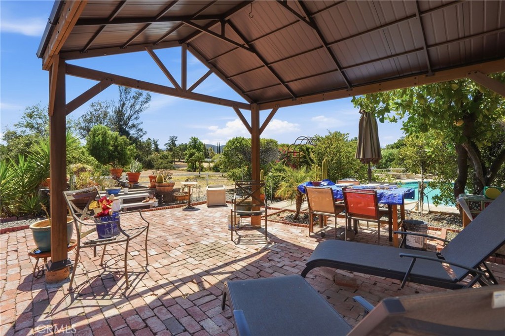 35780 Greer Road Murrieta, CA 92562 - Photo 50 of 56 Additional coverage patio area at north side of pool