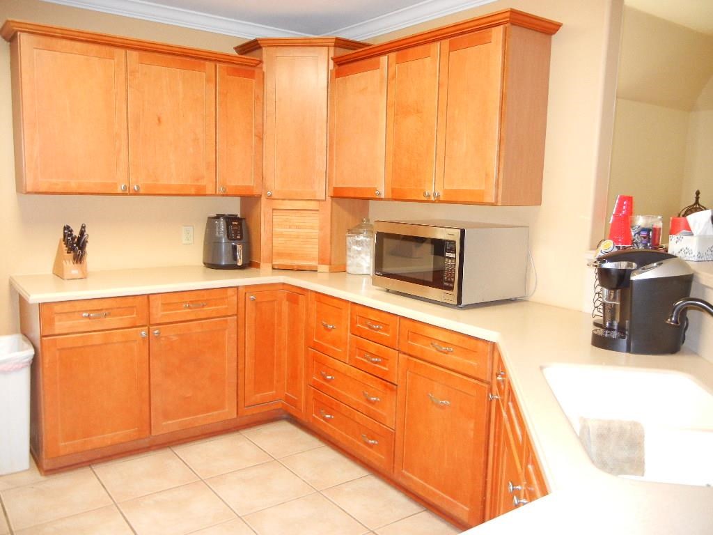 Maple cabinets, Corian countertops, tile floor