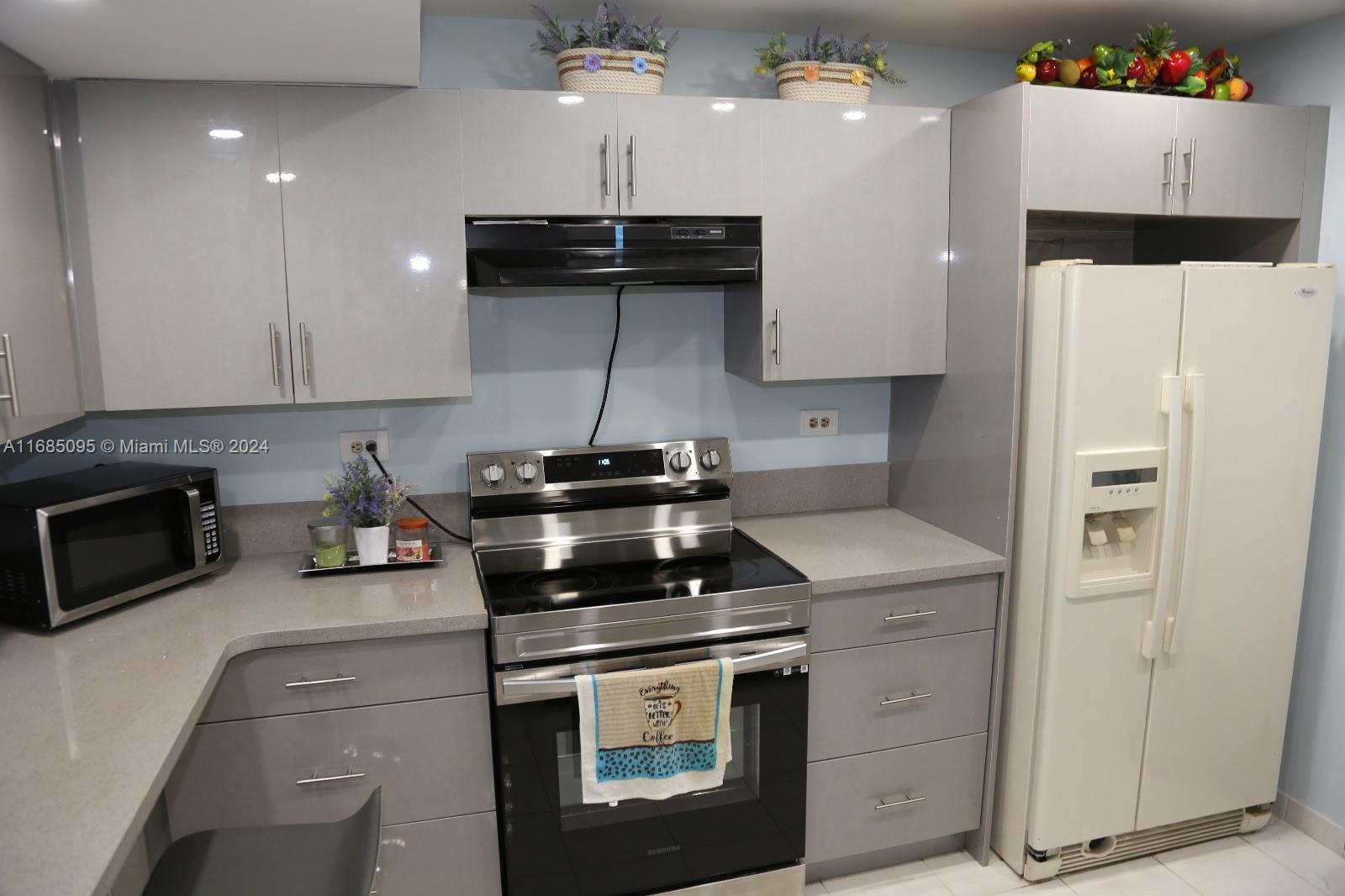a kitchen with a stove and a refrigerator