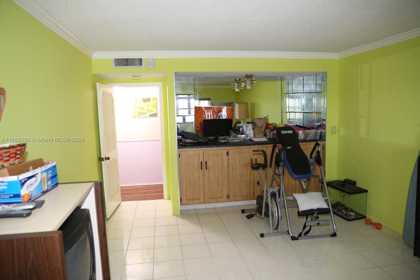 800 Northeast 195th Street, Unit 501 Miami, FL 33179 - Photo 16 of 39 a view of a room with gym equipment