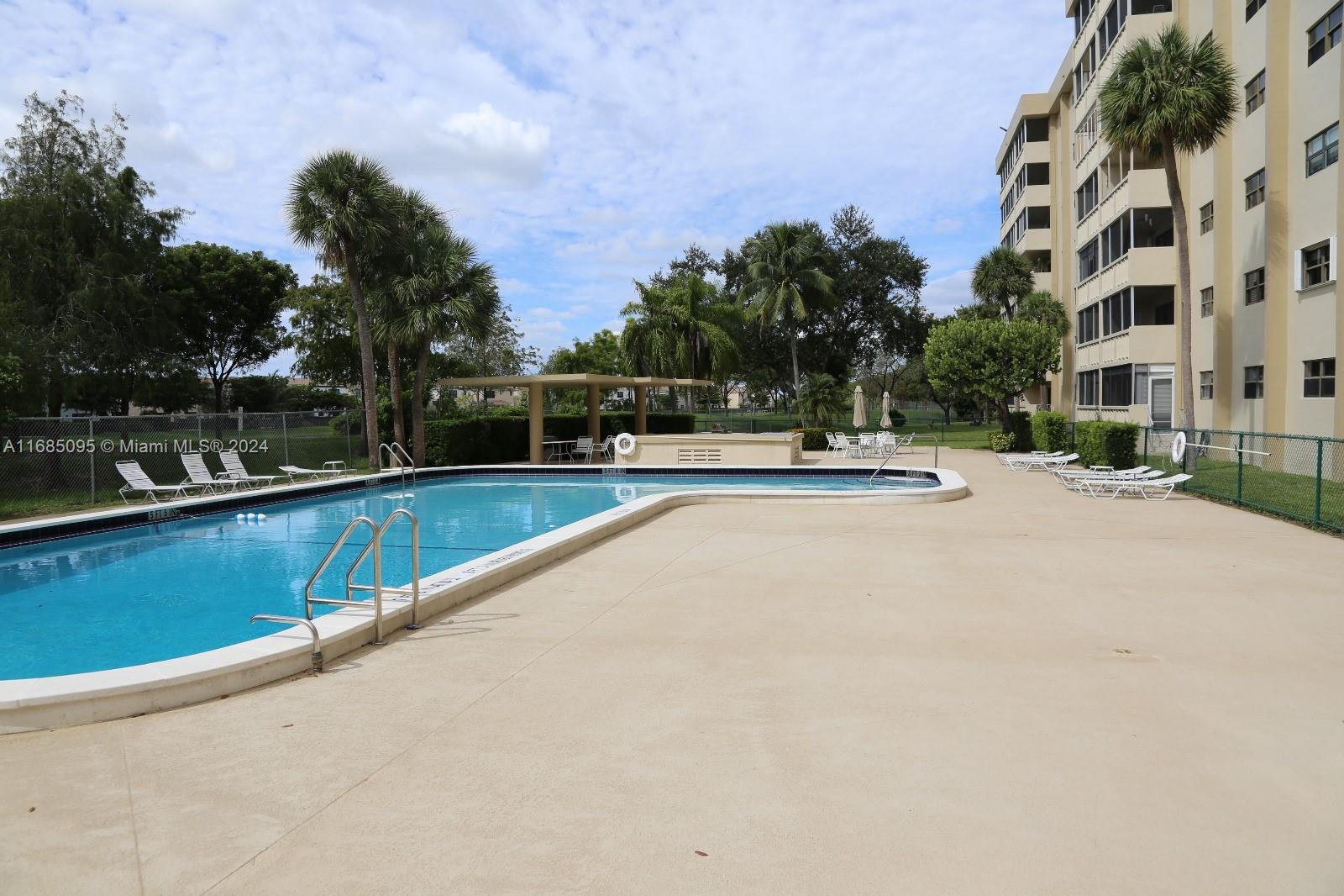 800 Northeast 195th Street, Unit 501 Miami, FL 33179 - Photo 36 of 39 a view of swimming pool with a outdoor space