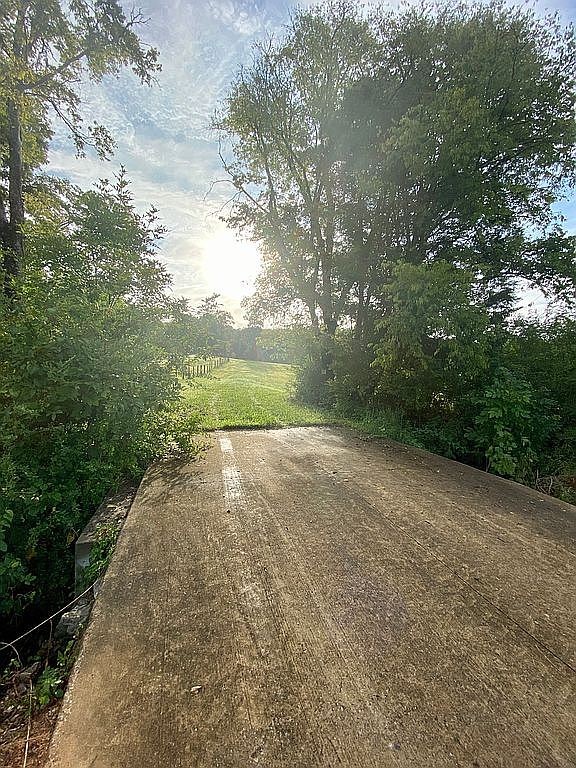 1398 Cliff Amos Road Spring Hill, TN 37174 - Photo 5 of 11 a view of a yard with large trees