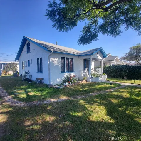 a living room with furniture and a lamp