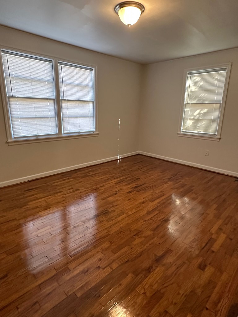 4250 Adams Street Columbus, GA 31907 - Photo 11 of 12 an empty room with wooden floor and windows