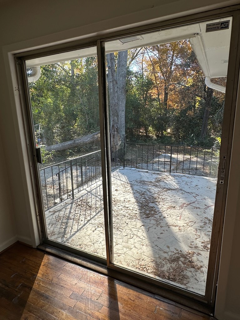 4250 Adams Street Columbus, GA 31907 - Photo 4 of 12 a view of a room with wooden floor and porch