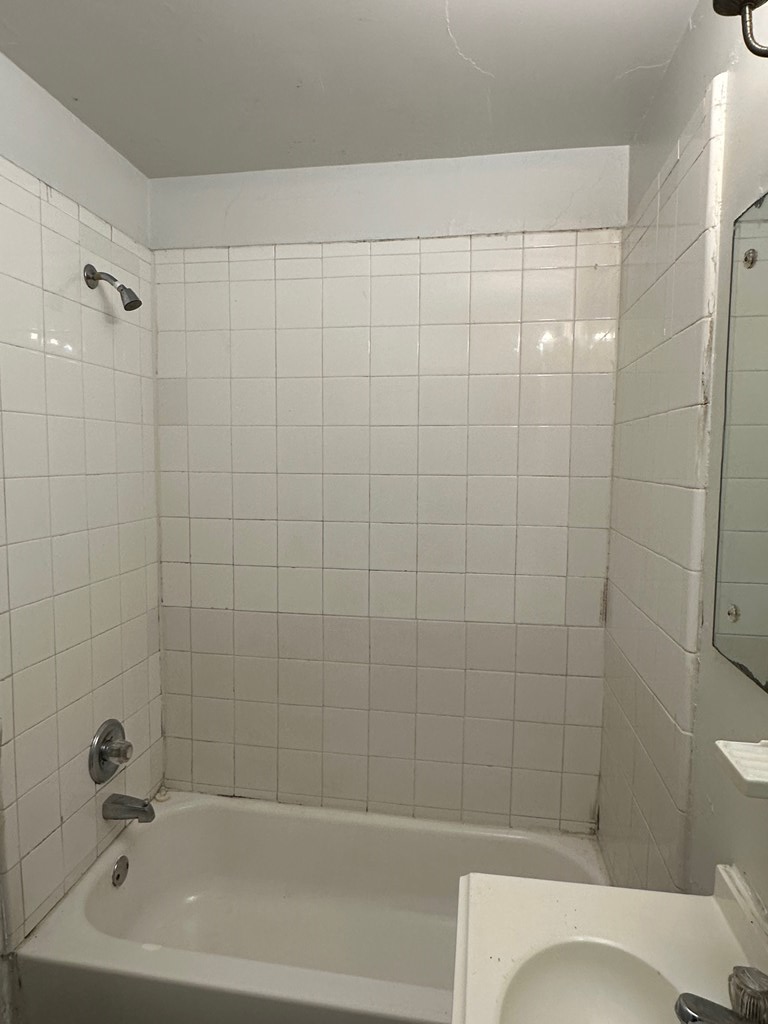4250 Adams Street Columbus, GA 31907 - Photo 10 of 12 a bathroom with a shower and a toilet