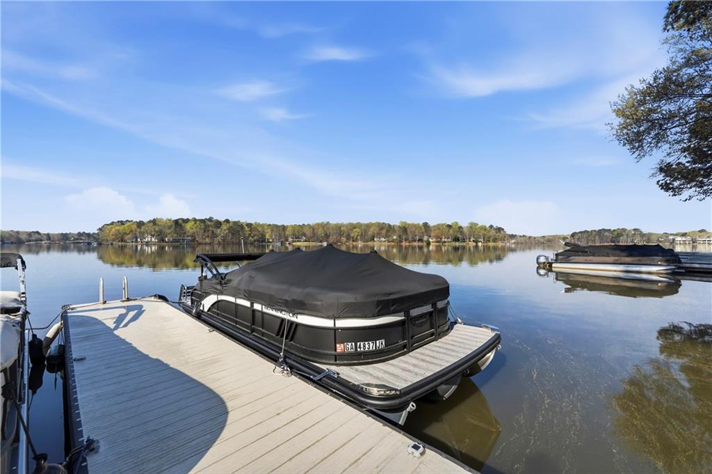 549 Old Phoenix Road Northeast, Unit 104 Eatonton, GA 31024 - Photo 2 of 49 a terrace with outdoor seating and city view