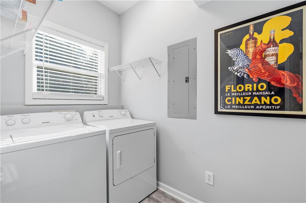 549 Old Phoenix Road Northeast, Unit 104 Eatonton, GA 31024 - Photo 21 of 49 a utility room with dryer and washer