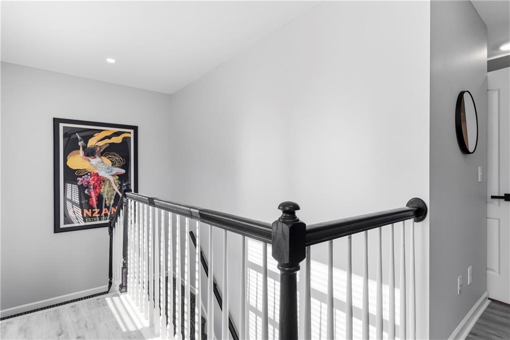 549 Old Phoenix Road Northeast, Unit 104 Eatonton, GA 31024 - Photo 23 of 49 a view of a hallway with a painting on the wall