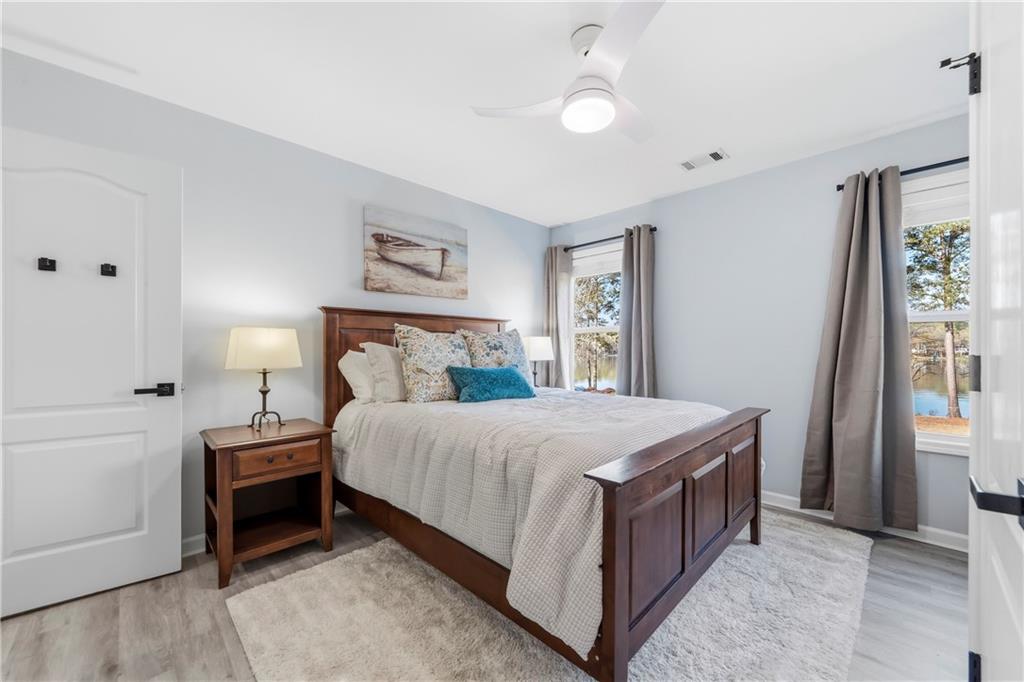 549 Old Phoenix Road Northeast, Unit 104 Eatonton, GA 31024 - Photo 24 of 49 a bedroom with a bed and a window