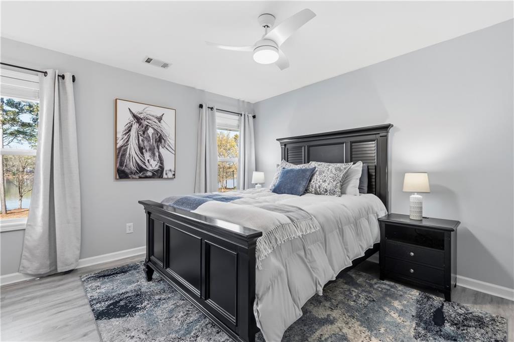 549 Old Phoenix Road Northeast, Unit 104 Eatonton, GA 31024 - Photo 28 of 49 a bedroom with a bed and a window