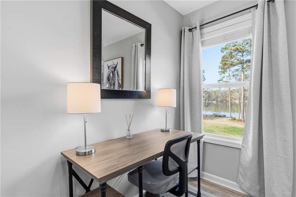 549 Old Phoenix Road Northeast, Unit 104 Eatonton, GA 31024 - Photo 30 of 49 a workspace with furniture and a window