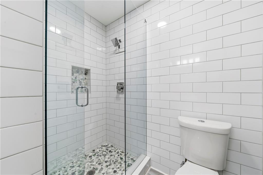 549 Old Phoenix Road Northeast, Unit 104 Eatonton, GA 31024 - Photo 32 of 49 a bathroom with a shower