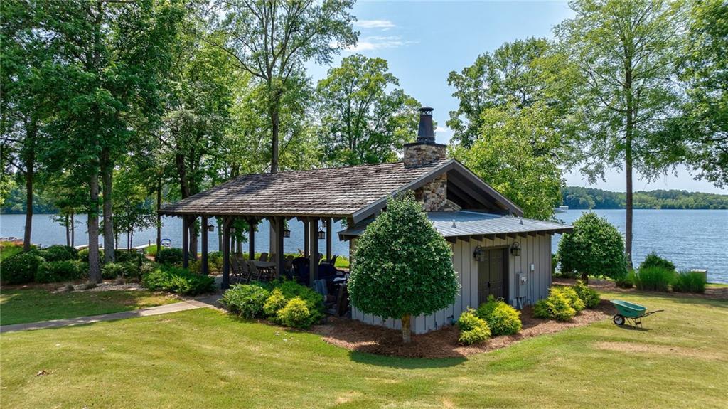 549 Old Phoenix Road Northeast, Unit 104 Eatonton, GA 31024 - Photo 40 of 49 a view of a house with pool and sitting area