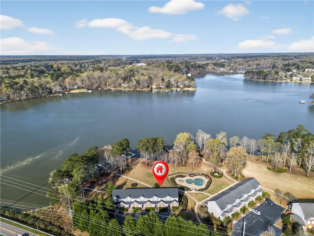 549 Old Phoenix Road Northeast, Unit 104 Eatonton, GA 31024 - Photo 42 of 49 an aerial view of a house with a yard and ocean view