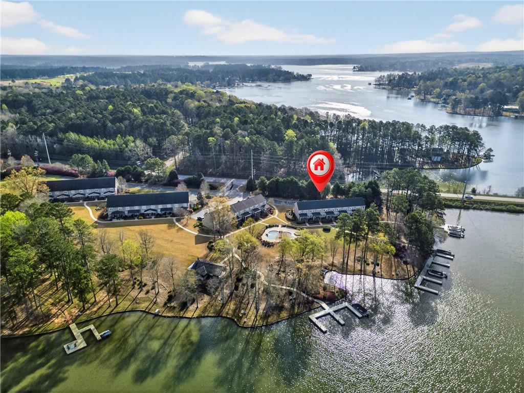 549 Old Phoenix Road Northeast, Unit 104 Eatonton, GA 31024 - Photo 44 of 49 a view of swimming pool with a yard and seating area