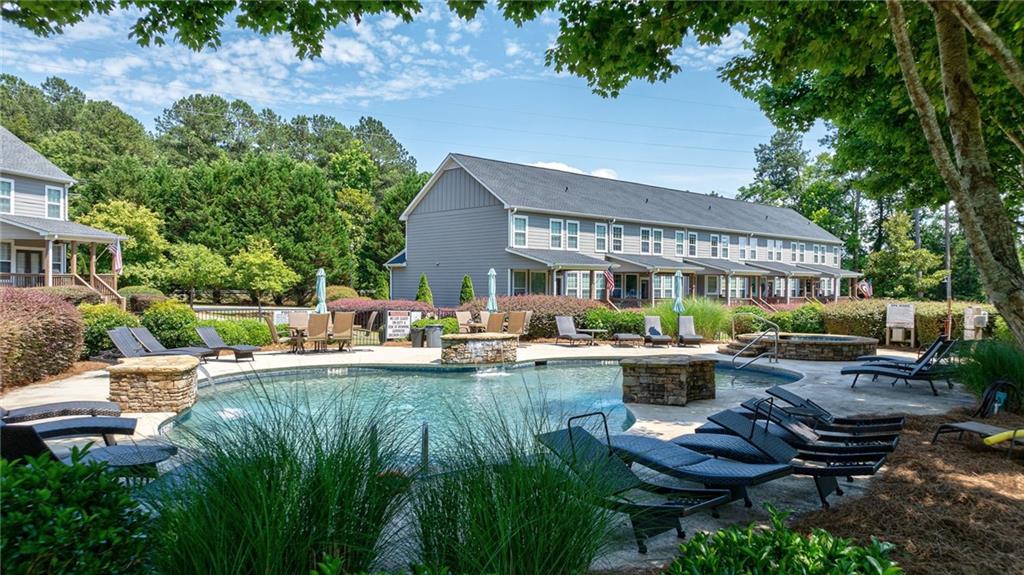 549 Old Phoenix Road Northeast, Unit 104 Eatonton, GA 31024 - Photo 46 of 49 a view of backyard of house with outdoor seating and green space