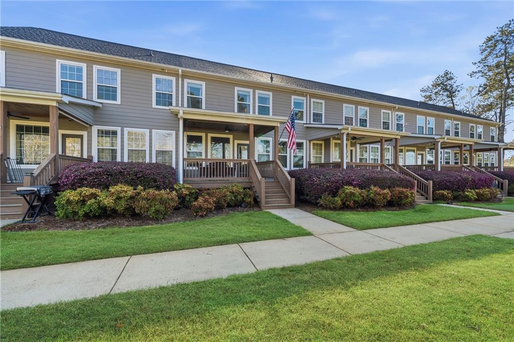 549 Old Phoenix Road Northeast, Unit 104 Eatonton, GA 31024 - Photo 49 of 49 a front view of a house with a garden